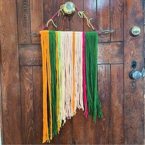 Handmade wall hanging on a cholla
